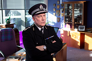 Scot Squad. Chief Commissioner Cameron Miekelson (Jack Docherty). Copyright: The Comedy Unit. Scot Squad. Chief Commissioner Cameron Miekelson (Jack Docherty). Copyright: The Comedy Unit.