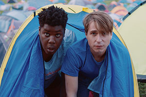 The Festival. Image shows from L to R: Shane (Hammed Animashaun), Nick (Joe Thomas). The Festival. Image shows from L to R: Shane (Hammed Animashaun), Nick (Joe Thomas).