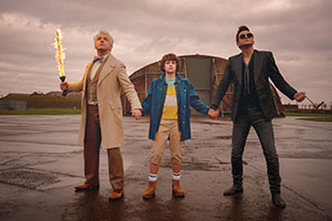 Good Omens. Image shows from L to R: Aziraphale (Michael Sheen), Adam Young (Sam Taylor Buck), Crowley (David Tennant). Good Omens. Image shows from L to R: Aziraphale (Michael Sheen), Adam Young (Sam Taylor Buck), Crowley (David Tennant).