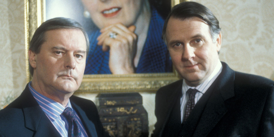 A Very Open Prison. Image shows from L to R: Prime Minister (John Fortune), David Hanratty (Tom Wilkinson). Copyright: Hat Trick Productions. A Very Open Prison. Image shows from L to R: Prime Minister (John Fortune), David Hanratty (Tom Wilkinson). Copyright: Hat Trick Productions.