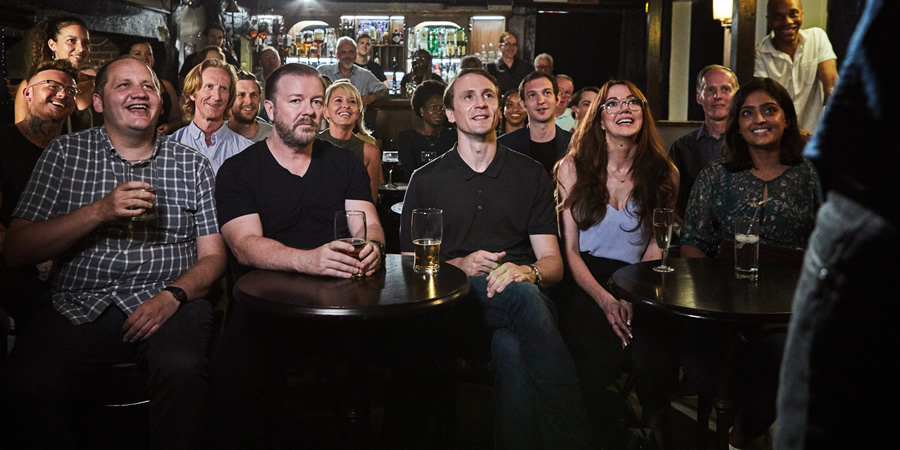 After Life. Image shows from L to R: Lenny (Tony Way), Tony (Ricky Gervais), Matt (Tom Basden), Kath (Diane Morgan), Sandy (Mandeep Dhillon). Copyright: Derek Productions. After Life. Image shows from L to R: Lenny (Tony Way), Tony (Ricky Gervais), Matt (Tom Basden), Kath (Diane Morgan), Sandy (Mandeep Dhillon). Copyright: Derek Productions.