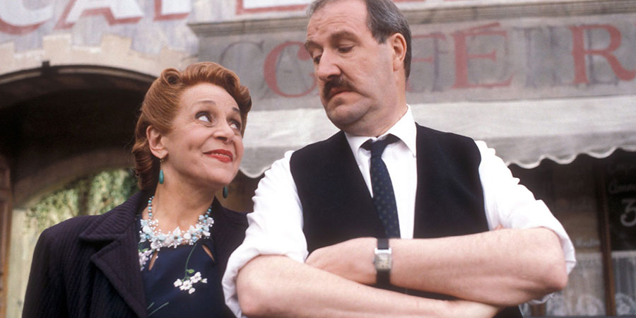 'Allo 'Allo!. Image shows from L to R: Edith Melba Artois (Carmen Silvera), René François Artois (Gorden Kaye). Copyright: BBC. 'Allo 'Allo!. Image shows from L to R: Edith Melba Artois (Carmen Silvera), René François Artois (Gorden Kaye). Copyright: BBC.