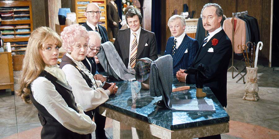 Are You Being Served?. Image shows from L to R: Miss Shirley Brahms (Wendy Richard), Mrs. Betty Slocombe (Mollie Sugden), Mr. Ernest Grainger (Arthur Brough), Mr. Cuthbert Rumbold (Nicholas Smith), Mr. Dick Lucas (Trevor Bannister), Mr. Wilberforce Clayborne Humphries (John Inman), Captain Stephen Peacock (Frank Thornton). Copyright: Anglo-EMI. Are You Being Served?. Image shows from L to R: Miss Shirley Brahms (Wendy Richard), Mrs. Betty Slocombe (Mollie Sugden), Mr. Ernest Grainger (Arthur Brough), Mr. Cuthbert Rumbold (Nicholas Smith), Mr. Dick Lucas (Trevor Bannister), Mr. Wilberforce Clayborne Humphries (John Inman), Captain Stephen Peacock (Frank Thornton). Copyright: Anglo-EMI.