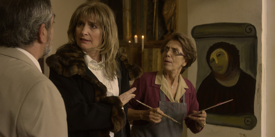 Behold The Monkey. Image shows from L to R: Mayor (Xisco Rodenas), Teresa Martinez (Assumpta Serna), Cecilia Giménez (Imma Colomer). Copyright: Wildcard Films. Behold The Monkey. Image shows from L to R: Mayor (Xisco Rodenas), Teresa Martinez (Assumpta Serna), Cecilia Giménez (Imma Colomer). Copyright: Wildcard Films.