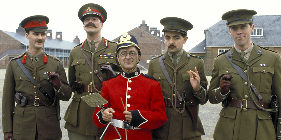 Blackadder. Image shows from L to R: Captain Kevin Darling (Tim McInnerny), Lord Melchett (Stephen Fry), Baldrick (Tony Robinson), Captain Edmund Blackadder (Rowan Atkinson), Lieutenant George Barleigh (Hugh Laurie). Blackadder. Image shows from L to R: Captain Kevin Darling (Tim McInnerny), Lord Melchett (Stephen Fry), Baldrick (Tony Robinson), Captain Edmund Blackadder (Rowan Atkinson), Lieutenant George Barleigh (Hugh Laurie).