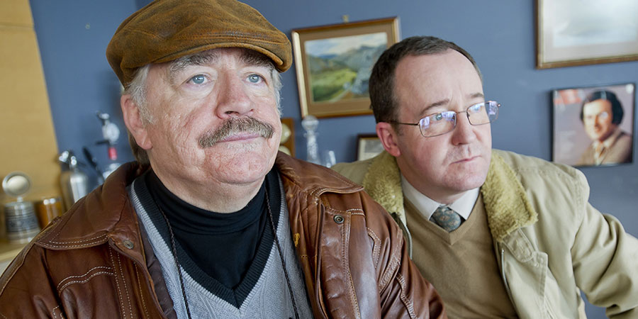 Bob Servant. Image shows from L to R: Bob Servant (Brian Cox), Frank (Jonathan Watson). Copyright: BBC. Bob Servant. Image shows from L to R: Bob Servant (Brian Cox), Frank (Jonathan Watson). Copyright: BBC.