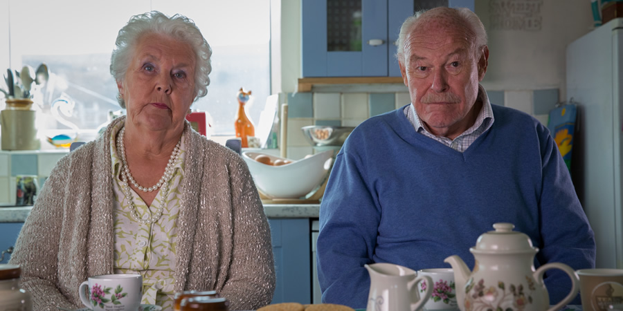 Broken Biscuits. Image shows from L to R: Pearl (Stephanie Cole), Milton (Timothy West). Copyright: Jellylegs. Broken Biscuits. Image shows from L to R: Pearl (Stephanie Cole), Milton (Timothy West). Copyright: Jellylegs.
