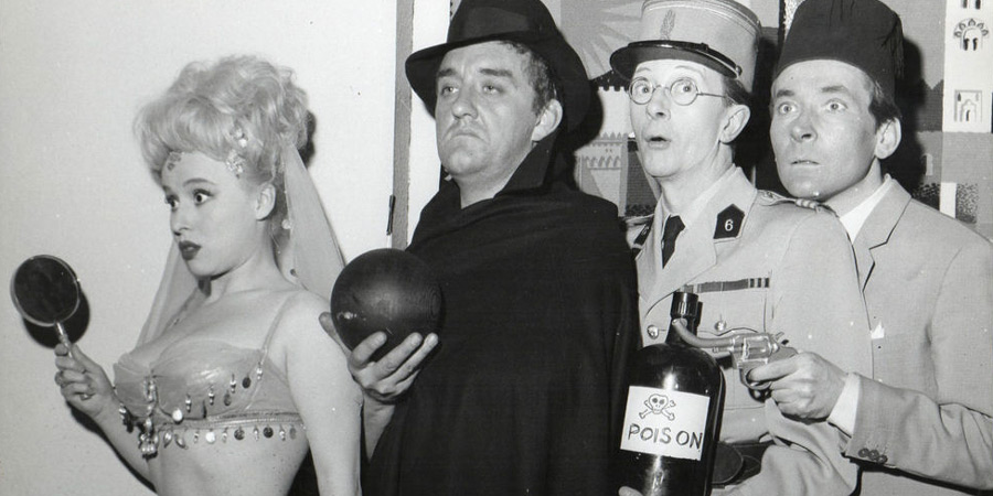 Carry On Spying. Image shows from L to R: Daphne Honeybutt (Barbara Windsor), Harold Crump (Bernard Cribbins), Charlie Bind (Charles Hawtrey), Desmond Simkins (Kenneth Williams). Copyright: Peter Rogers Productions / Studio Canal. Carry On Spying. Image shows from L to R: Daphne Honeybutt (Barbara Windsor), Harold Crump (Bernard Cribbins), Charlie Bind (Charles Hawtrey), Desmond Simkins (Kenneth Williams). Copyright: Peter Rogers Productions / Studio Canal.