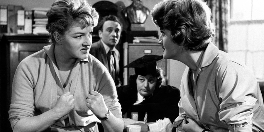 Carry On Teacher. Image shows from L to R: Miss Sarah Allcock (Joan Sims), Mr. Gregory Adams (Kenneth Connor), Miss Grace Short (Hattie Jacques), Miss Felicity Wheeler (Rosalind Knight). Copyright: Peter Rogers Productions / STUDIOCANAL. Carry On Teacher. Image shows from L to R: Miss Sarah Allcock (Joan Sims), Mr. Gregory Adams (Kenneth Connor), Miss Grace Short (Hattie Jacques), Miss Felicity Wheeler (Rosalind Knight). Copyright: Peter Rogers Productions / STUDIOCANAL.