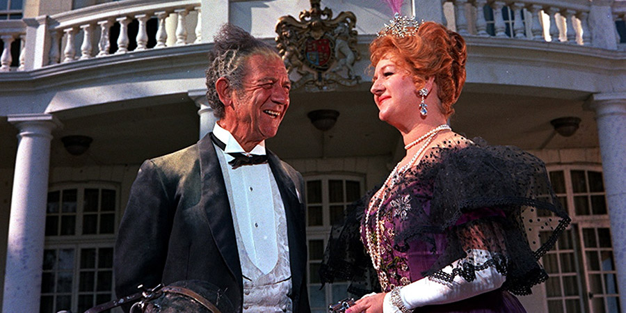 Carry On... Up The Khyber. Image shows from L to R: Sir Sidney Ruff-Diamond (Sid James), Lady Ruff-Diamond (Joan Sims). Copyright: Peter Rogers Productions. Carry On... Up The Khyber. Image shows from L to R: Sir Sidney Ruff-Diamond (Sid James), Lady Ruff-Diamond (Joan Sims). Copyright: Peter Rogers Productions.