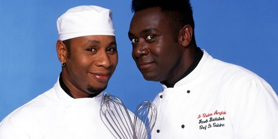 Chef!. Image shows from L to R: Everton Stonehead (Roger Griffiths), Gareth Blackstock (Lenny Henry). Chef!. Image shows from L to R: Everton Stonehead (Roger Griffiths), Gareth Blackstock (Lenny Henry).