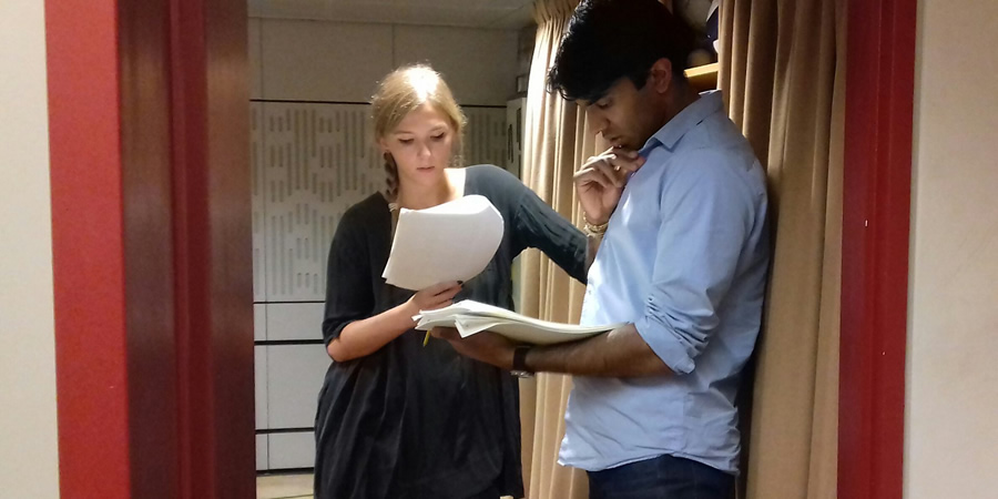 Cooking In A Bedsitter. Image shows from L to R: Trisha (Beattie Edmondson), Deepak (Nikesh Patel). Copyright: BBC. Cooking In A Bedsitter. Image shows from L to R: Trisha (Beattie Edmondson), Deepak (Nikesh Patel). Copyright: BBC.