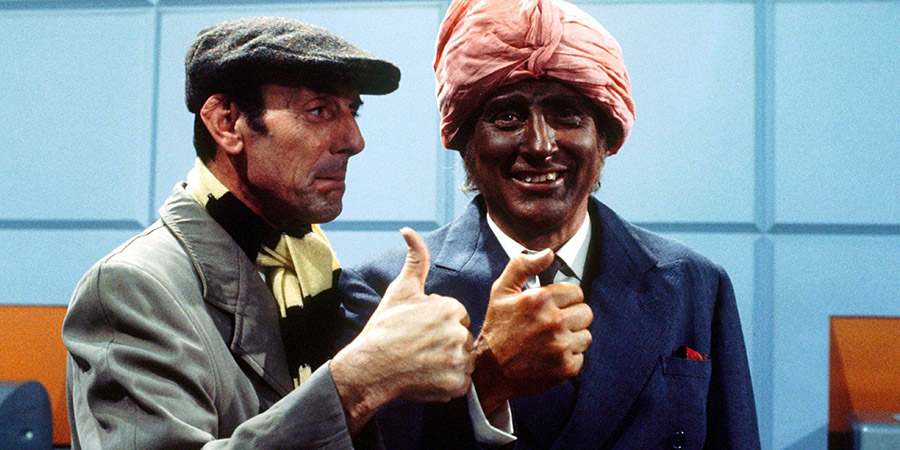 Curry & Chips. Image shows from L to R: Arthur Blenkinsop (Eric Sykes), Kevin O'Grady (Spike Milligan). Copyright: London Weekend Television. Curry & Chips. Image shows from L to R: Arthur Blenkinsop (Eric Sykes), Kevin O'Grady (Spike Milligan). Copyright: London Weekend Television.