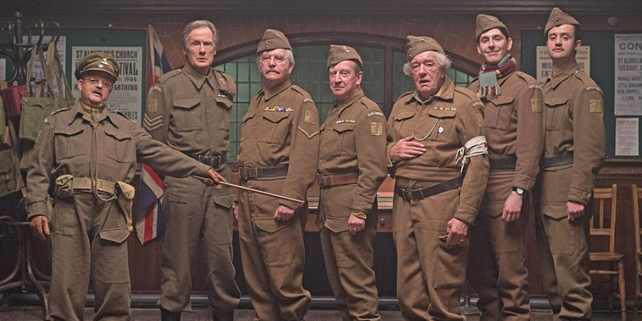 Dad's Army. Image shows from L to R: Captain George Mainwaring (Toby Jones), Sergeant Arthur Wilson (Bill Nighy), Corporal Jack Jones (Tom Courtenay), Private Frazer (Bill Paterson), Private Godfrey (Michael Gambon), Private Frank Pike (Blake Harrison), Private Joe Walker (Daniel Mays). Copyright: Universal Pictures / DJ Films. Dad's Army. Image shows from L to R: Captain George Mainwaring (Toby Jones), Sergeant Arthur Wilson (Bill Nighy), Corporal Jack Jones (Tom Courtenay), Private Frazer (Bill Paterson), Private Godfrey (Michael Gambon), Private Frank Pike (Blake Harrison), Private Joe Walker (Daniel Mays). Copyright: Universal Pictures / DJ Films.