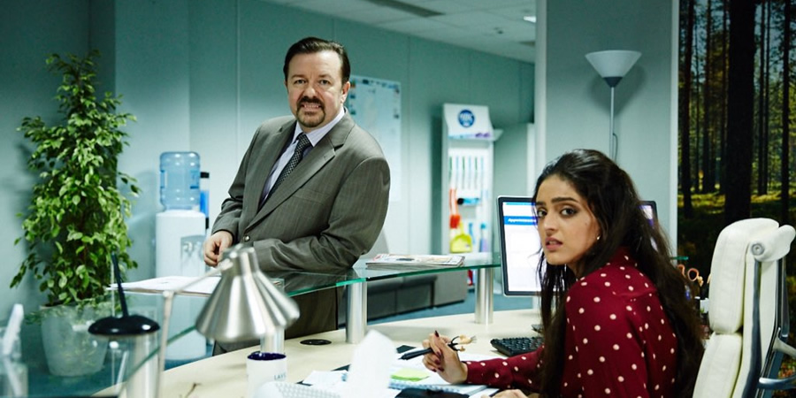 David Brent: Life On The Road. Image shows from L to R: David Brent (Ricky Gervais), Karen (Mandeep Dhillon). David Brent: Life On The Road. Image shows from L to R: David Brent (Ricky Gervais), Karen (Mandeep Dhillon).