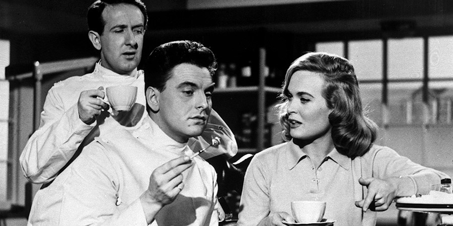 Dentist On The Job. Image shows from L to R: Brian Dexter (Ronnie Stevens), David Cookson (Bob Monkhouse), Jill Venner (Shirley Eaton). Copyright: Bertram Ostrer Productions. Dentist On The Job. Image shows from L to R: Brian Dexter (Ronnie Stevens), David Cookson (Bob Monkhouse), Jill Venner (Shirley Eaton). Copyright: Bertram Ostrer Productions.