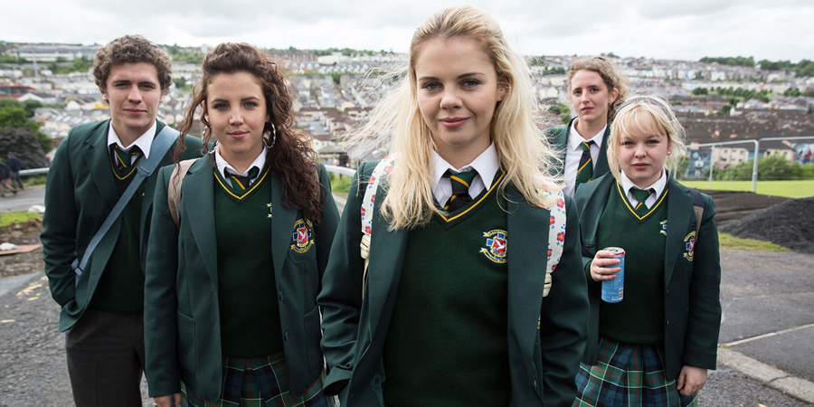 Derry Girls. Image shows from L to R: James Maguire (Dylan Llewellyn), Michelle Mallon (Jamie-Lee O'Donnell), Erin Quinn (Saoirse-Monica Jackson), Orla McCool (Louisa Harland), Clare Devlin (Nicola Coughlan). Copyright: Hat Trick Productions. Derry Girls. Image shows from L to R: James Maguire (Dylan Llewellyn), Michelle Mallon (Jamie-Lee O'Donnell), Erin Quinn (Saoirse-Monica Jackson), Orla McCool (Louisa Harland), Clare Devlin (Nicola Coughlan). Copyright: Hat Trick Productions.