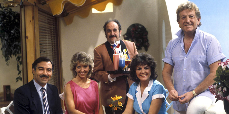 Duty Free. Image shows from L to R: Robert Cochran (Neil Stacy), Linda Cochran (Joanna Van Gyseghem), Carlos (Carlos Douglas), Amy Pearce (Gwen Taylor), David Pearce (Keith Barron). Copyright: Yorkshire Television. Duty Free. Image shows from L to R: Robert Cochran (Neil Stacy), Linda Cochran (Joanna Van Gyseghem), Carlos (Carlos Douglas), Amy Pearce (Gwen Taylor), David Pearce (Keith Barron). Copyright: Yorkshire Television.