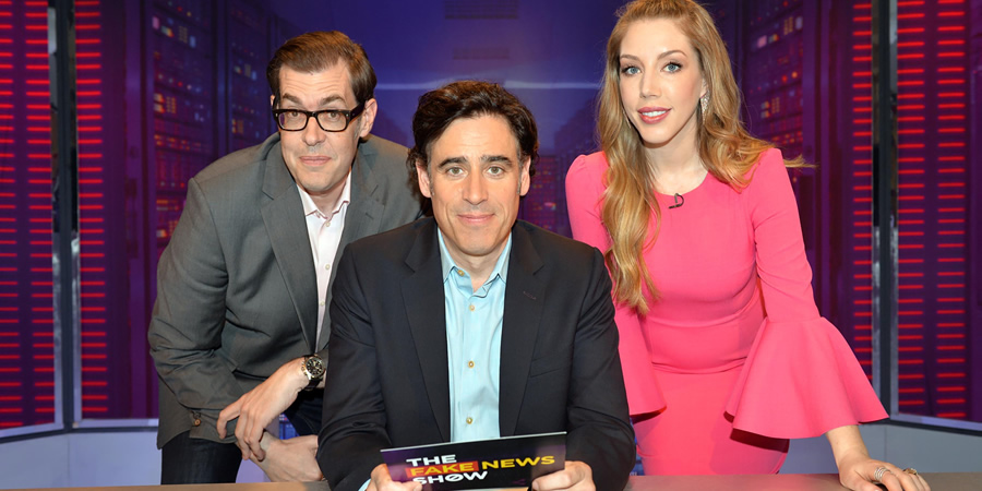 The Fake News Show. Image shows from L to R: Richard Osman, Stephen Mangan, Katherine Ryan. Copyright: Hat Trick Productions. The Fake News Show. Image shows from L to R: Richard Osman, Stephen Mangan, Katherine Ryan. Copyright: Hat Trick Productions.