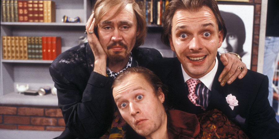 Filthy Rich & Catflap. Image shows from L to R: Ralph Filthy (Nigel Planer), Eddie Catflap (Adrian Edmondson), Richie Rich (Rik Mayall). Copyright: BBC. Filthy Rich & Catflap. Image shows from L to R: Ralph Filthy (Nigel Planer), Eddie Catflap (Adrian Edmondson), Richie Rich (Rik Mayall). Copyright: BBC.