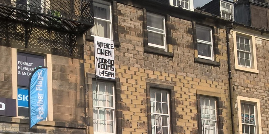 Laurence Owen has put a bedsheet out his window to promote his show. Copyright: BCG. Laurence Owen has put a bedsheet out his window to promote his show. Copyright: BCG.