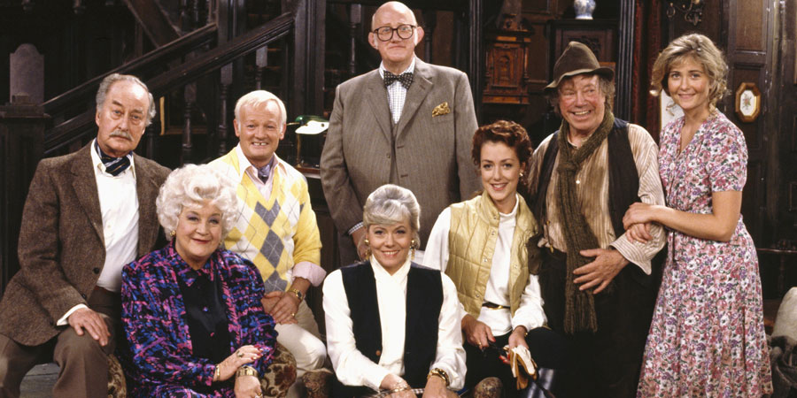 Grace & Favour. Image shows from L to R: Captain Stephen Peacock (Frank Thornton), Mrs. Betty Slocombe (Mollie Sugden), Mr. Wilberforce Clayborne Humphries (John Inman), Miss Shirley Brahms (Wendy Richard), Mr. Cuthbert Rumbold (Nicholas Smith), Jessica Lovelock (Joanne Heywood), Maurice Moulterd (Billy Burden), Mavis Moulterd (Fleur Bennett). Copyright: BBC. Grace & Favour. Image shows from L to R: Captain Stephen Peacock (Frank Thornton), Mrs. Betty Slocombe (Mollie Sugden), Mr. Wilberforce Clayborne Humphries (John Inman), Miss Shirley Brahms (Wendy Richard), Mr. Cuthbert Rumbold (Nicholas Smith), Jessica Lovelock (Joanne Heywood), Maurice Moulterd (Billy Burden), Mavis Moulterd (Fleur Bennett). Copyright: BBC.