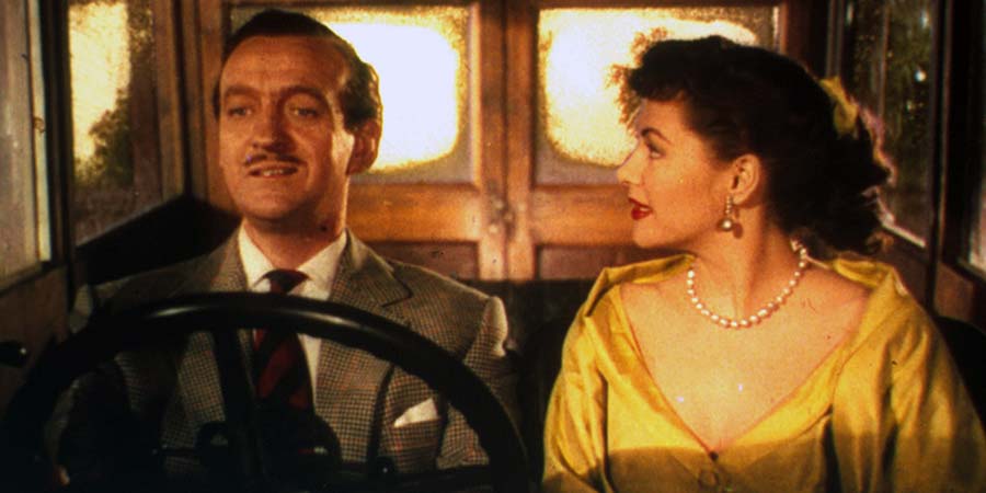 Happy Ever After. Image shows from L to R: Jasper O'Leary (David Niven), Serena McGlusky (Yvonne de Carlo). Copyright: STUDIOCANAL. Happy Ever After. Image shows from L to R: Jasper O'Leary (David Niven), Serena McGlusky (Yvonne de Carlo). Copyright: STUDIOCANAL.