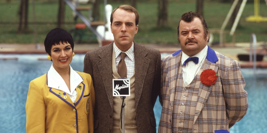 Hi-De-Hi!. Image shows from L to R: Gladys Pugh (Ruth Madoc), Jeffrey Fairbrother (Simon Cadell), Ted Bovis (Paul Shane). Copyright: BBC. Hi-De-Hi!. Image shows from L to R: Gladys Pugh (Ruth Madoc), Jeffrey Fairbrother (Simon Cadell), Ted Bovis (Paul Shane). Copyright: BBC.