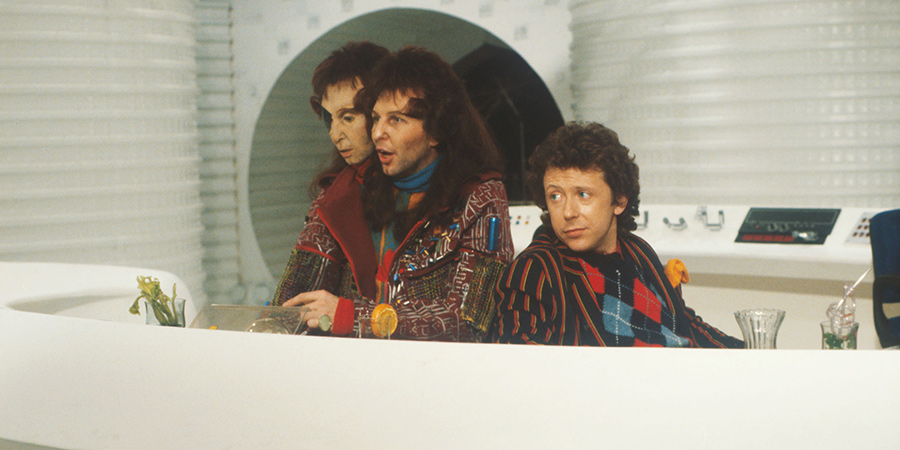 The Hitchhiker's Guide To The Galaxy. Image shows from L to R: Zaphod Beeblebrox (Mark Wing-Davey), Ford Prefect (David Dixon). Copyright: BBC. The Hitchhiker's Guide To The Galaxy. Image shows from L to R: Zaphod Beeblebrox (Mark Wing-Davey), Ford Prefect (David Dixon). Copyright: BBC.