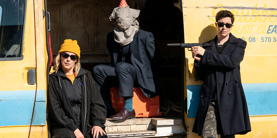 Hitmen. Image shows from L to R: Jamie (Mel Giedroyc), The Lawyer (Jason Watkins), Fran (Sue Perkins). Copyright: Tiger Aspect Productions. Hitmen. Image shows from L to R: Jamie (Mel Giedroyc), The Lawyer (Jason Watkins), Fran (Sue Perkins). Copyright: Tiger Aspect Productions.