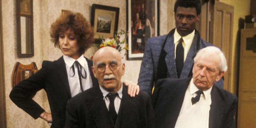 In Sickness & In Health. Image shows from L to R: Rita (Una Stubbs), Alf Garnett (Warren Mitchell), Winston (Eamonn Walker), Arthur (Arthur English). Copyright: BBC. In Sickness & In Health. Image shows from L to R: Rita (Una Stubbs), Alf Garnett (Warren Mitchell), Winston (Eamonn Walker), Arthur (Arthur English). Copyright: BBC.