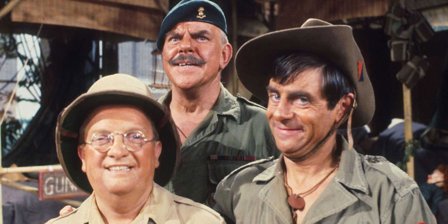 It Ain't Half Hot Mum. Image shows from L to R: Gunner 'Lofty' Sugden (Don Estelle), BSM Geoffrey 'Shut Up' Williams (Windsor Davies), Bombardier 'Gloria' Beaumont (Melvyn Hayes). Copyright: BBC. It Ain't Half Hot Mum. Image shows from L to R: Gunner 'Lofty' Sugden (Don Estelle), BSM Geoffrey 'Shut Up' Williams (Windsor Davies), Bombardier 'Gloria' Beaumont (Melvyn Hayes). Copyright: BBC.