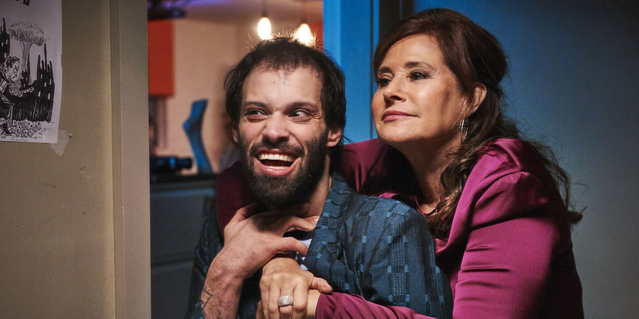 Jerk. Image shows from L to R: Tim (Tim Renkow), Tim's Mom (Lorraine Bracco). Jerk. Image shows from L to R: Tim (Tim Renkow), Tim's Mom (Lorraine Bracco).