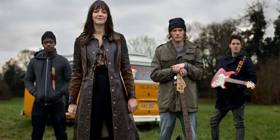 Kat And The Band. Image shows from L to R: Sid (Idris Debrand), Kat Malone (Ella Hunt), Alex (Dougie Poynter), Brian (Callum McGowan). Kat And The Band. Image shows from L to R: Sid (Idris Debrand), Kat Malone (Ella Hunt), Alex (Dougie Poynter), Brian (Callum McGowan).