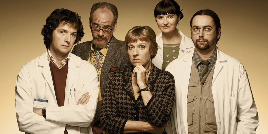 Lab Rats. Image shows from L to R: Dr Alex Beenyman (Chris Addison), Professor John Mycroft (Geoffrey McGivern), Dean Mieke Miedema (Selina Cadell), Cara McIlvenny (Jo Enright), Brian Lalumaca (Dan Tetsell). Copyright: BBC. Lab Rats. Image shows from L to R: Dr Alex Beenyman (Chris Addison), Professor John Mycroft (Geoffrey McGivern), Dean Mieke Miedema (Selina Cadell), Cara McIlvenny (Jo Enright), Brian Lalumaca (Dan Tetsell). Copyright: BBC.