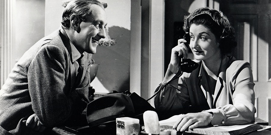 Last Holiday. Image shows from L to R: George Bird (Alec Guinness), Miss Mellows (Helen Cherry). Copyright: STUDIOCANAL. Last Holiday. Image shows from L to R: George Bird (Alec Guinness), Miss Mellows (Helen Cherry). Copyright: STUDIOCANAL.