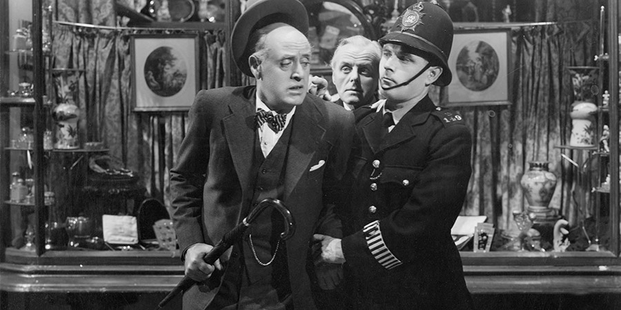 Laughter In Paradise. Image shows from L to R: Captain James Deniston Russell (Alastair Sim), Unknown, Station Constable (Colin Gordon). Laughter In Paradise. Image shows from L to R: Captain James Deniston Russell (Alastair Sim), Unknown, Station Constable (Colin Gordon).