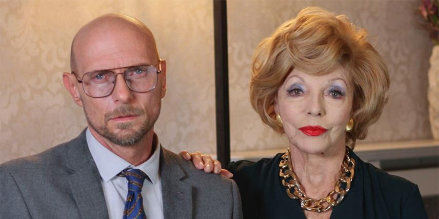 The Loss Adjuster. Image shows from L to R: Martin Dyer (Luke Goss), Margaret Rogerton-Sykes (Joan Collins). The Loss Adjuster. Image shows from L to R: Martin Dyer (Luke Goss), Margaret Rogerton-Sykes (Joan Collins).