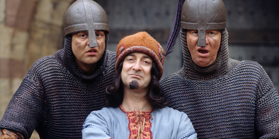 Maid Marian And Her Merry Men. Image shows from L to R: Gary (Mark Billingham), The Sheriff of Nottingham (Tony Robinson), Graeme (David Lloyd). Copyright: BBC. Maid Marian And Her Merry Men. Image shows from L to R: Gary (Mark Billingham), The Sheriff of Nottingham (Tony Robinson), Graeme (David Lloyd). Copyright: BBC.