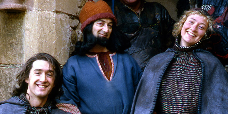 Maid Marian And Her Merry Men. Image shows from L to R: Robin (Adam Morris), The Sheriff of Nottingham (Tony Robinson), Maid Marian (Kate Lonergan). Copyright: BBC. Maid Marian And Her Merry Men. Image shows from L to R: Robin (Adam Morris), The Sheriff of Nottingham (Tony Robinson), Maid Marian (Kate Lonergan). Copyright: BBC.