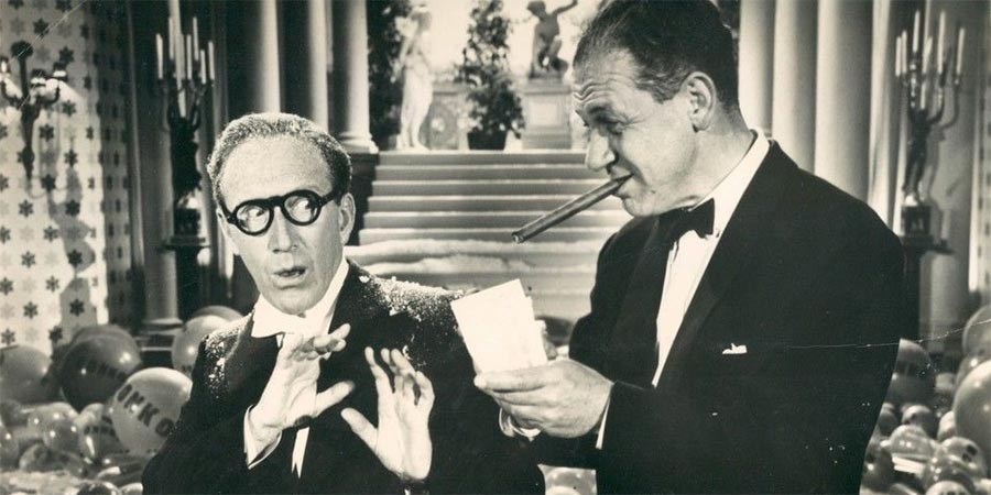 Make Mine A Million. Image shows from L to R: Arthur Ashton (Arthur Askey), Sid Gibson (Sid James). Make Mine A Million. Image shows from L to R: Arthur Ashton (Arthur Askey), Sid Gibson (Sid James).