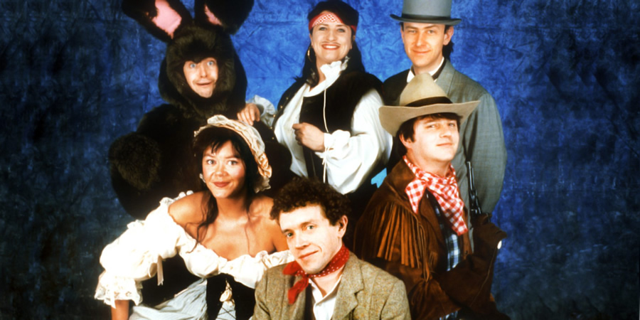 The Masterson Inheritance. Image shows from L to R: Phelim McDermott, Josie Lawrence, Jim Sweeney, Caroline Quentin, Lee Simpson, Paul Merton. Copyright: BBC. The Masterson Inheritance. Image shows from L to R: Phelim McDermott, Josie Lawrence, Jim Sweeney, Caroline Quentin, Lee Simpson, Paul Merton. Copyright: BBC.