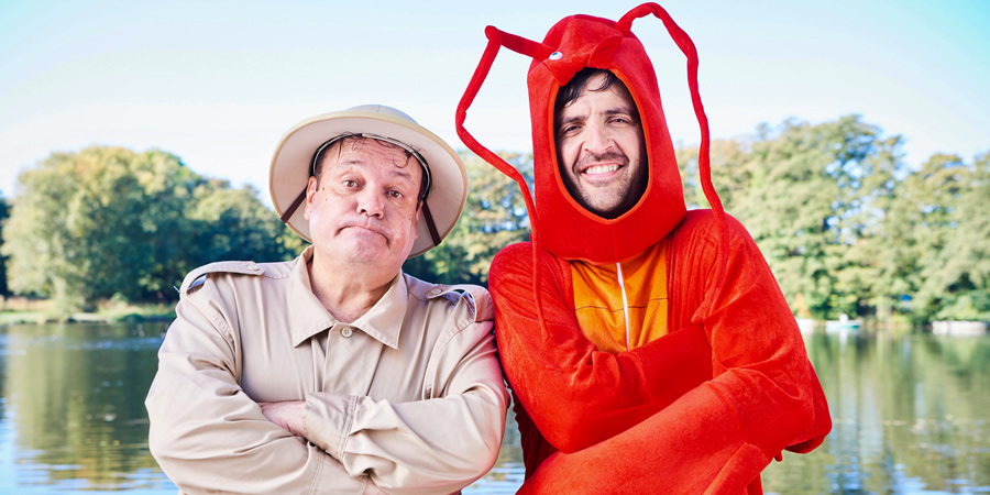 Mister Winner. Image shows from L to R: Chris Smith (Shaun Williamson), Lesley Winner (Spencer Jones). Copyright: BBC. Mister Winner. Image shows from L to R: Chris Smith (Shaun Williamson), Lesley Winner (Spencer Jones). Copyright: BBC.