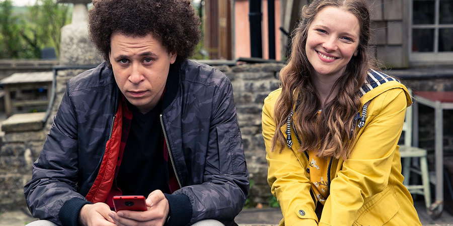 Outsiders!!. Image shows from L to R: Zak (Connor Allen), Mari (Morfydd Clark). Outsiders!!. Image shows from L to R: Zak (Connor Allen), Mari (Morfydd Clark).