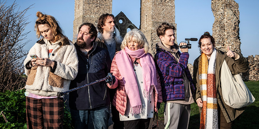Pandemonium. Image shows from L to R: Amy (Freya Parks), Paul (Jim Howick), Robin (Tom Basden), Sue (Alison Steadman), Sam (Jack Christou), Rachel (Katherine Parkinson). Copyright: BBC Studios. Pandemonium. Image shows from L to R: Amy (Freya Parks), Paul (Jim Howick), Robin (Tom Basden), Sue (Alison Steadman), Sam (Jack Christou), Rachel (Katherine Parkinson). Copyright: BBC Studios.