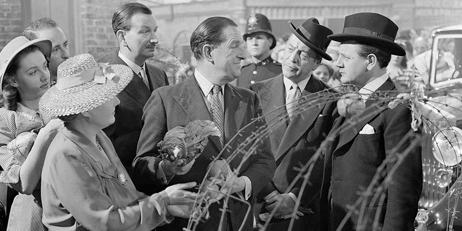 Passport To Pimlico. Image shows from L to R: Mr. P.J. Wix (Raymond Huntley), Arthur Pemberton (Stanley Holloway), Gregg (Basil Radford), Straker (Naunton Wayne). Copyright: Ealing Studios / STUDIOCANAL. Passport To Pimlico. Image shows from L to R: Mr. P.J. Wix (Raymond Huntley), Arthur Pemberton (Stanley Holloway), Gregg (Basil Radford), Straker (Naunton Wayne). Copyright: Ealing Studios / STUDIOCANAL.