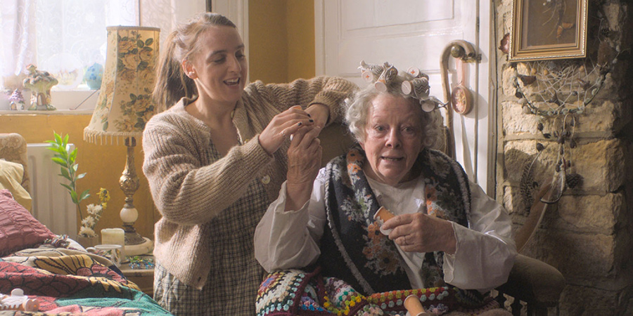 Please Help. Image shows from L to R: Milly (Lucy Pearman), Nan (Anna Calder-Marshall). Copyright: Tiger Aspect Productions. Please Help. Image shows from L to R: Milly (Lucy Pearman), Nan (Anna Calder-Marshall). Copyright: Tiger Aspect Productions.