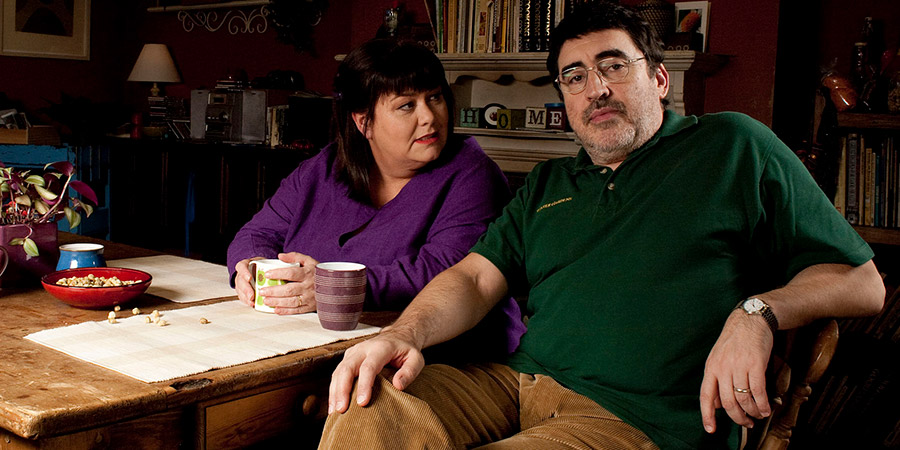 Roger & Val Have Just Got In. Image shows from L to R: Val Stevenson (Dawn French), Roger Stevenson (Alfred Molina). Copyright: BBC. Roger & Val Have Just Got In. Image shows from L to R: Val Stevenson (Dawn French), Roger Stevenson (Alfred Molina). Copyright: BBC.