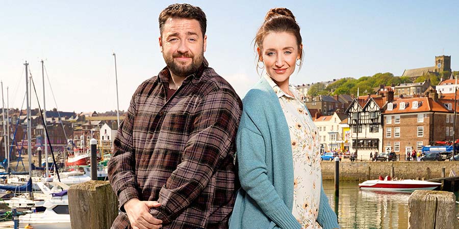 Scarborough. Image shows from L to R: Mike (Jason Manford), Karen (Catherine Tyldesley). Copyright: BBC Studios. Scarborough. Image shows from L to R: Mike (Jason Manford), Karen (Catherine Tyldesley). Copyright: BBC Studios.