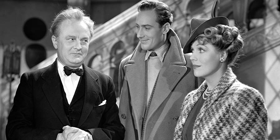 Spring Meeting. Image shows from L to R: James, the Butler (Basil Sydney), Tony Fox-Collier (Michael Wilding), "Tiny" Peto (Enid Stamp-Taylor). Copyright: Associated British Picture Corporation. Spring Meeting. Image shows from L to R: James, the Butler (Basil Sydney), Tony Fox-Collier (Michael Wilding), "Tiny" Peto (Enid Stamp-Taylor). Copyright: Associated British Picture Corporation.